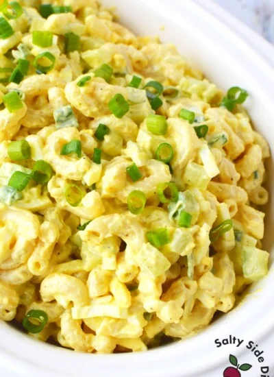 large white bowl of classic macaroni salad.