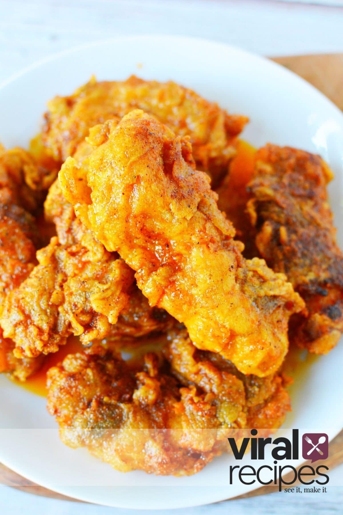 pile of chicken on a white plate.
