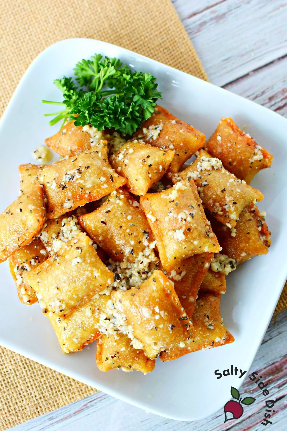 pile of tiktok pizza rolls on a white plate.