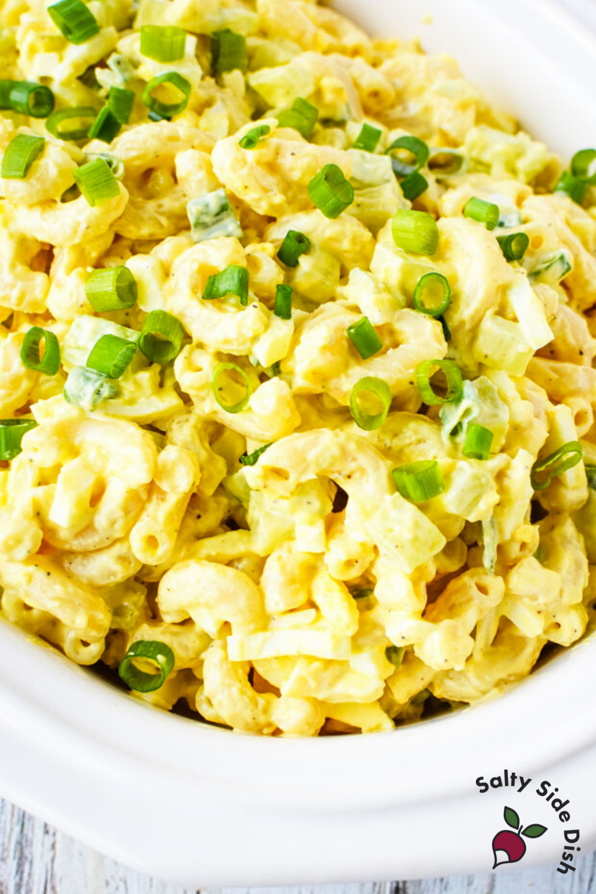 old fashioned macaroni salad recipe ready to serve up to a crowd party platter for holiday season