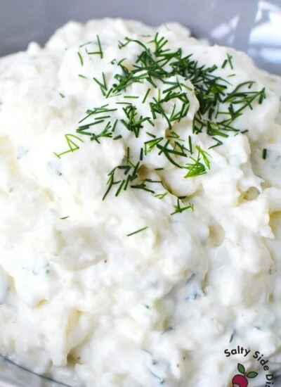 close up image of garlic dip with chives.