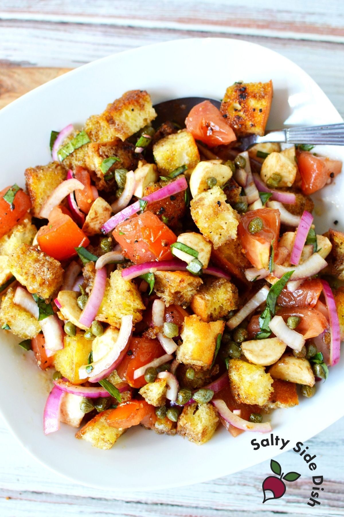 plate of bread salad and tomatoes.