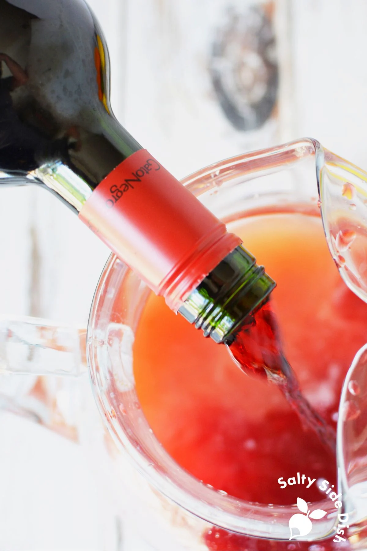 merlot being poured into pitcher.