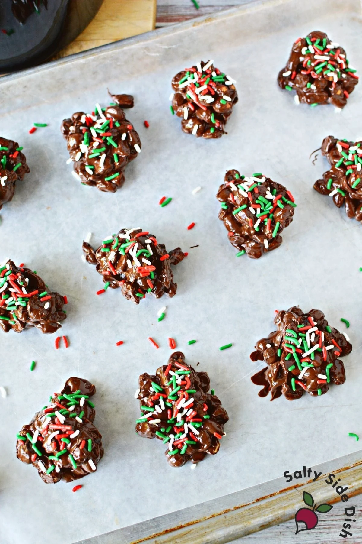 3 ingredient peanut clusters on a sheet of parchment paper.