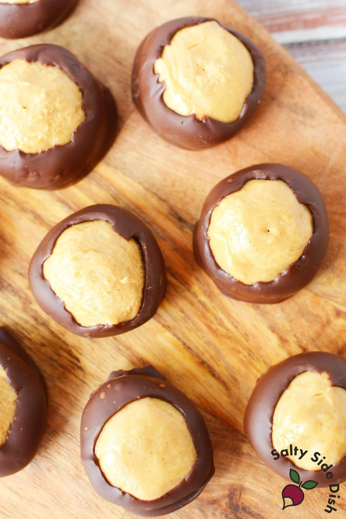 group of buckeye balls on a cutting board.