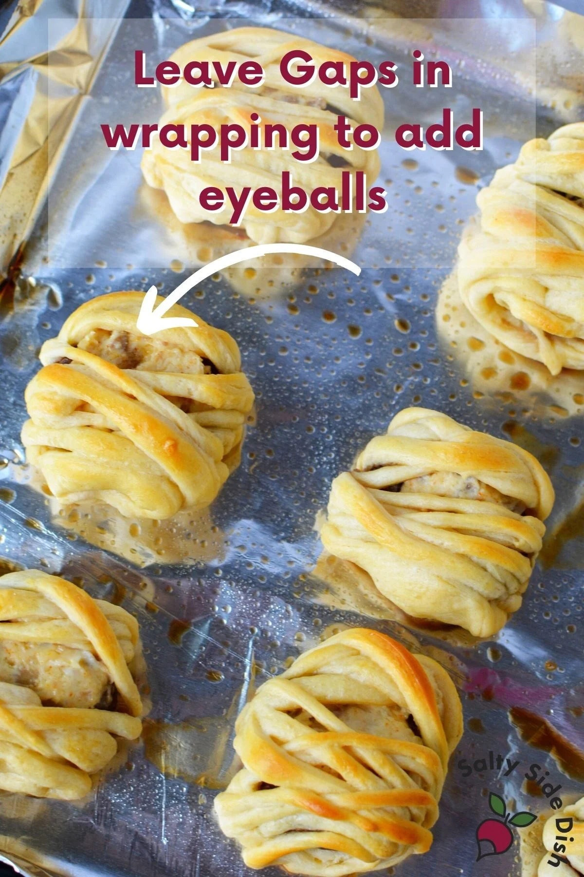 stuffed mushrooms tips laying on a sheet.