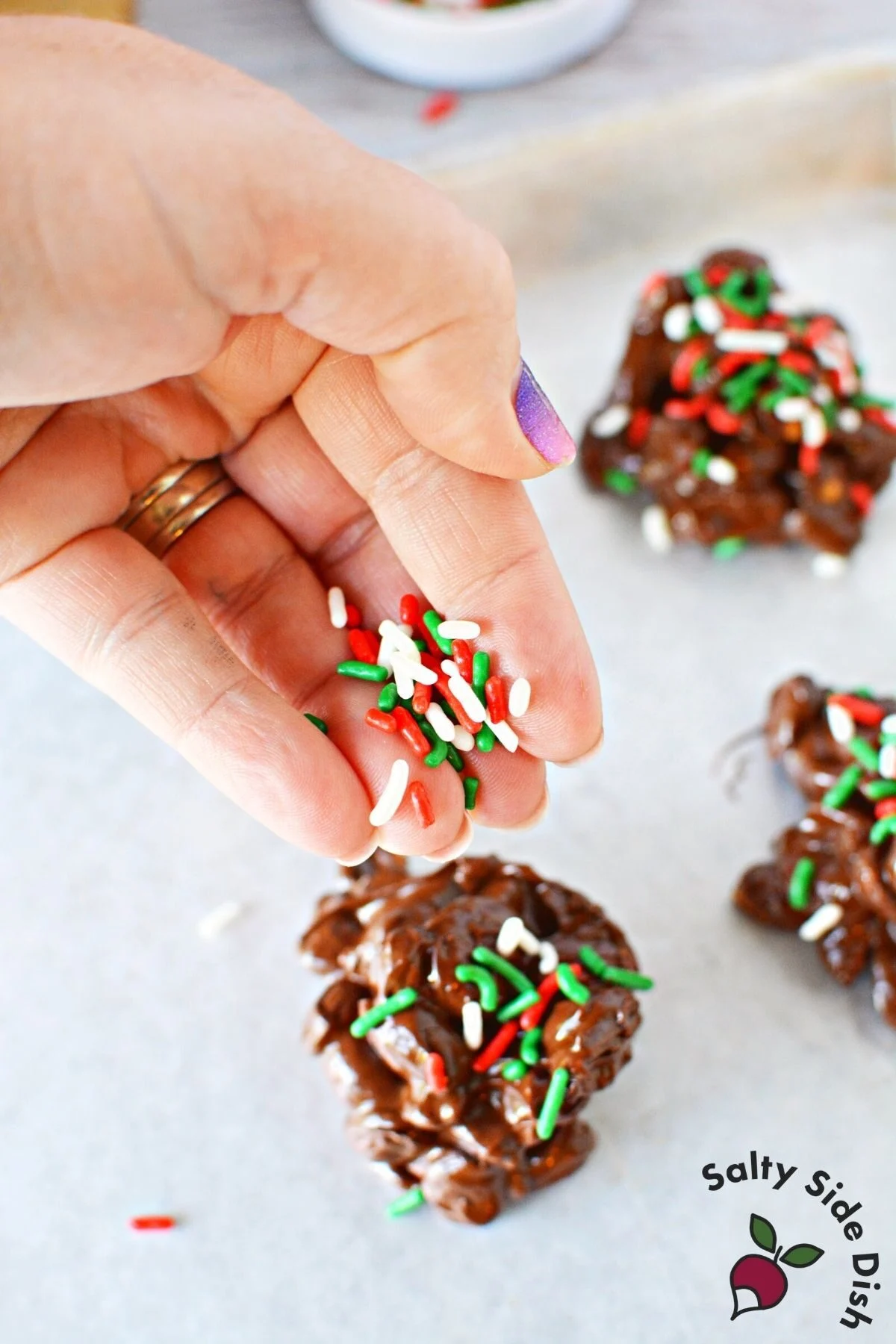 sprinkling on jimmies to peanut clusters.