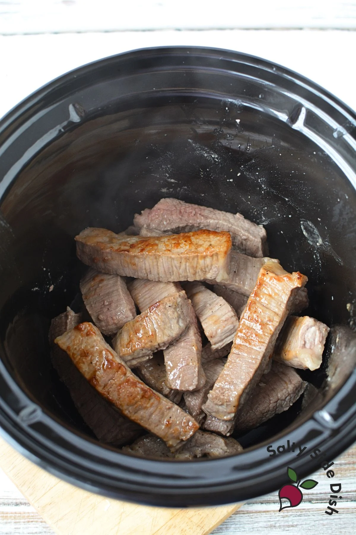 sear sirloin strips and then add to a crockpot