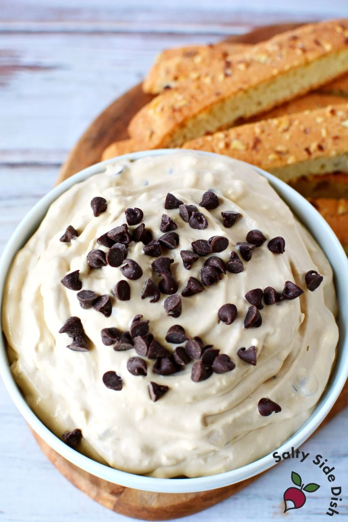 cappuccino dip in a bowl with a side of biscotti.
