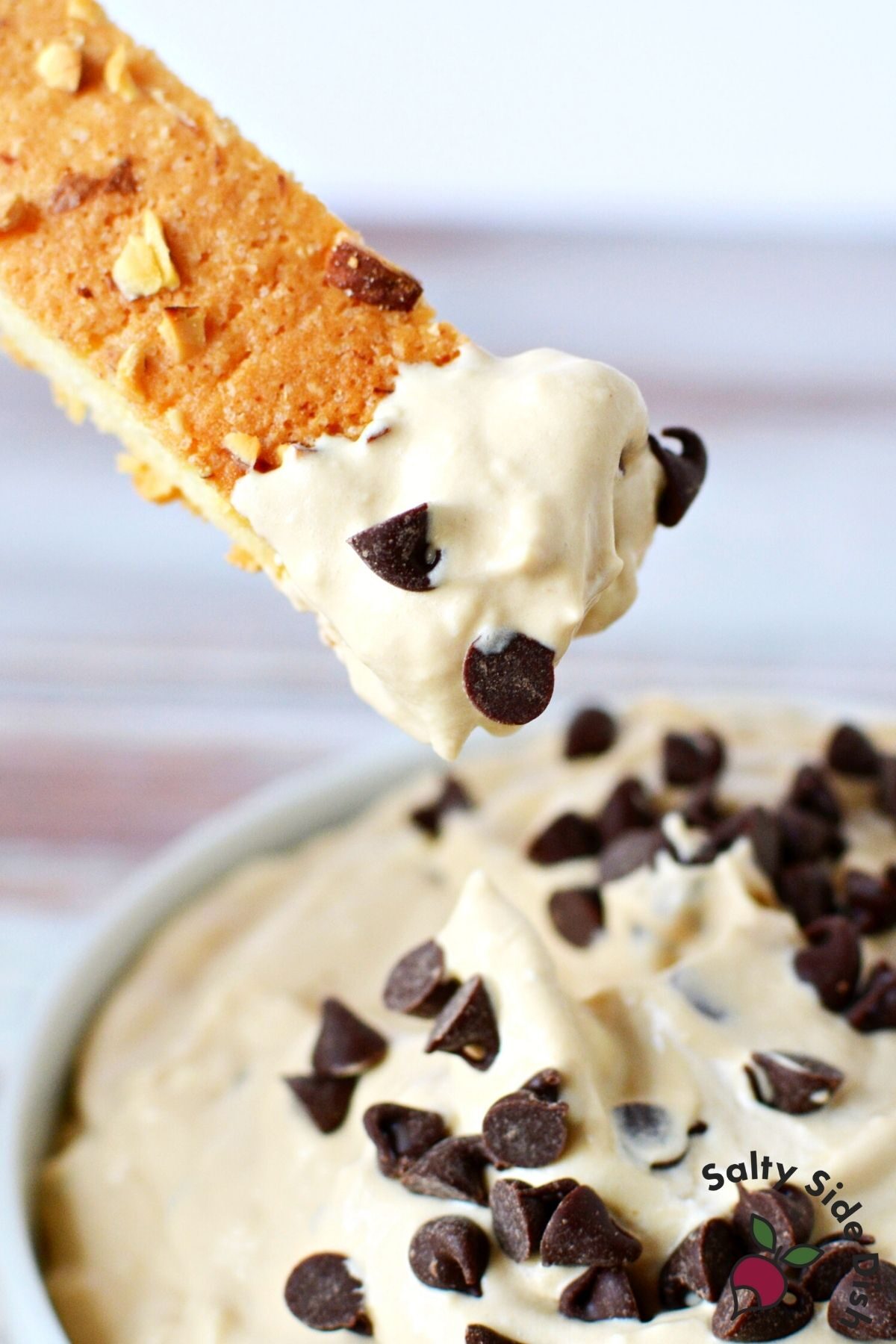 dip hanging off a cookie.