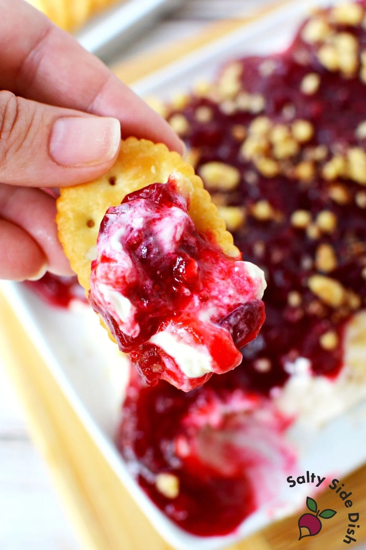 cranberry dip with ritz cracker.