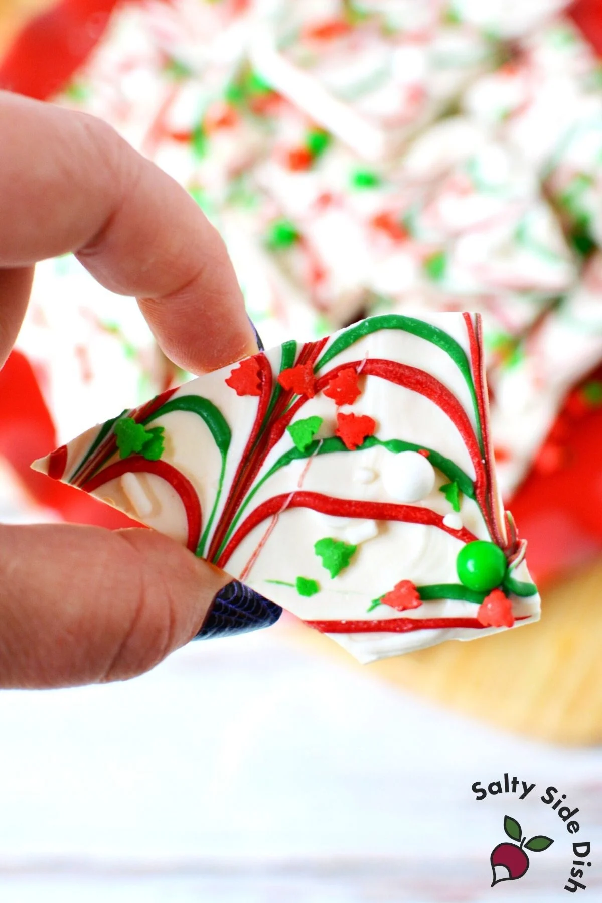 holiday christmas bark broken being held.