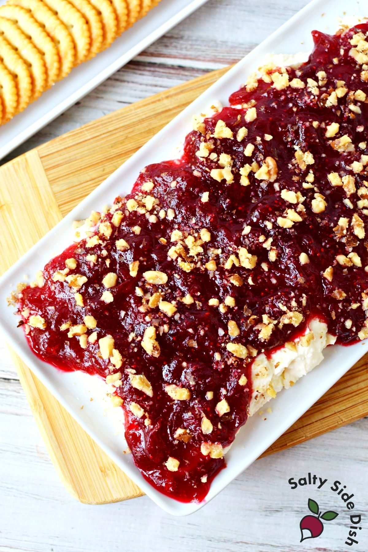 whipped feta cranberry dip with walnuts on a plate.