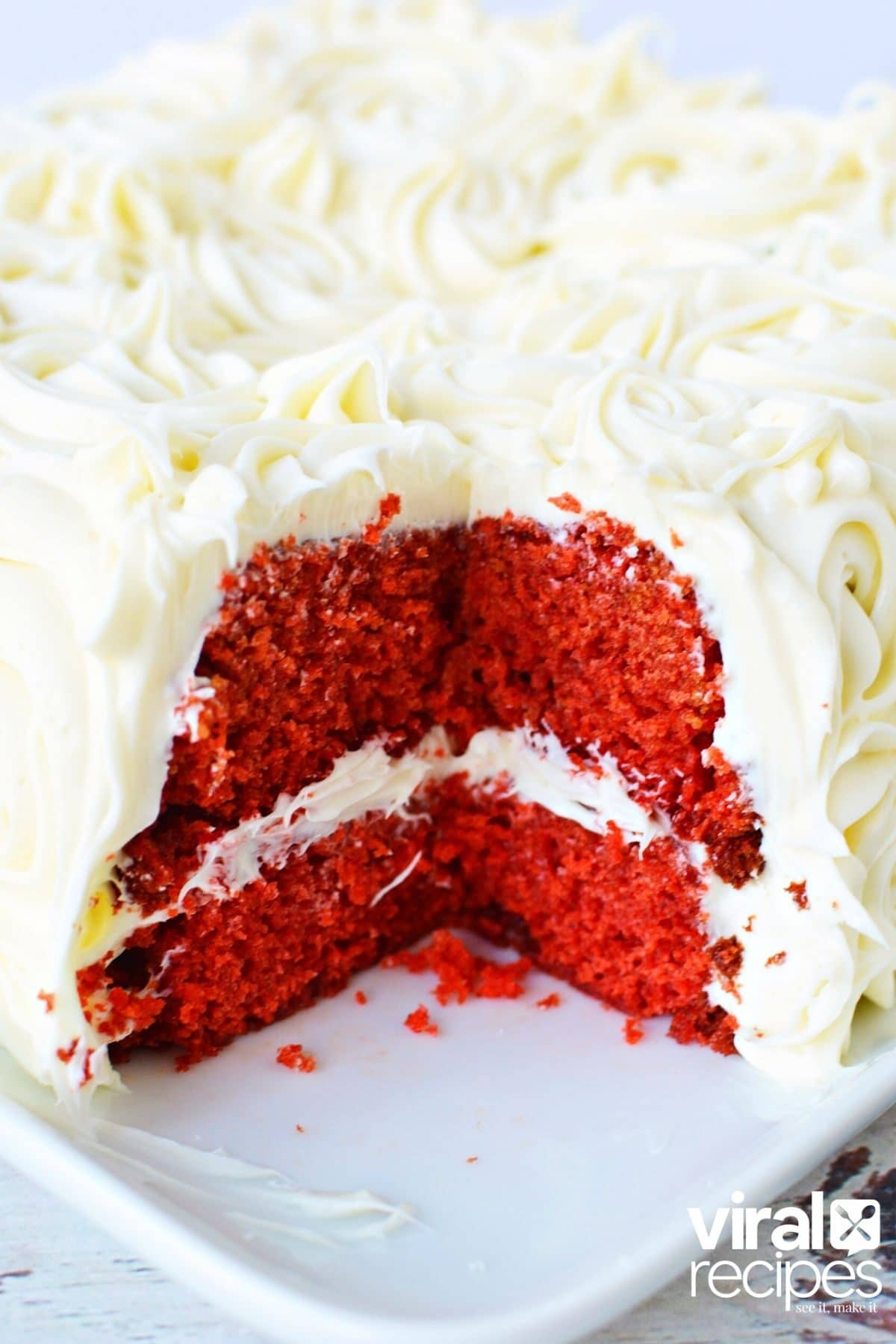 cut open cake that shows the middle of the spice cake and frosting.