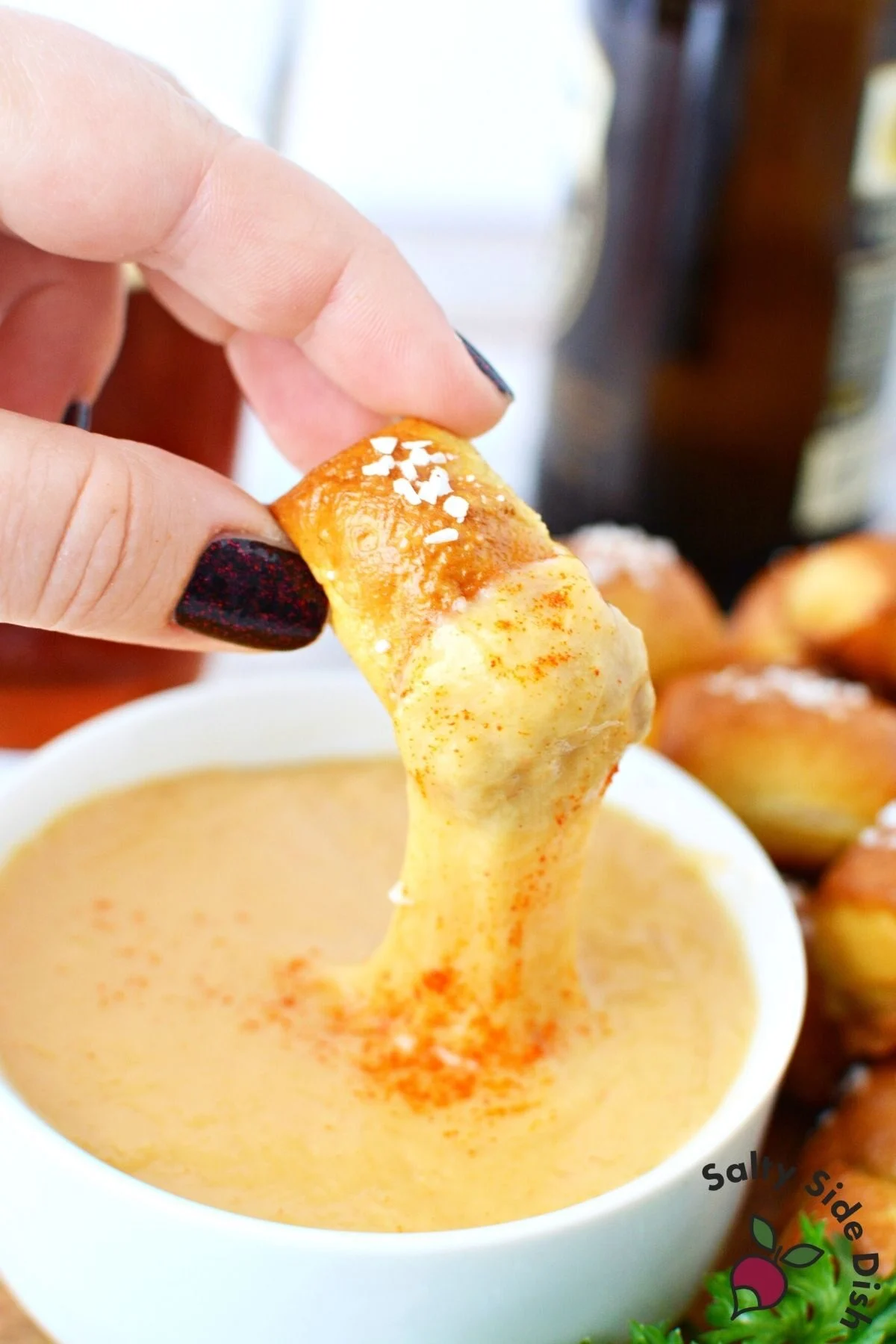 dip soft pretzel into beer cheese.