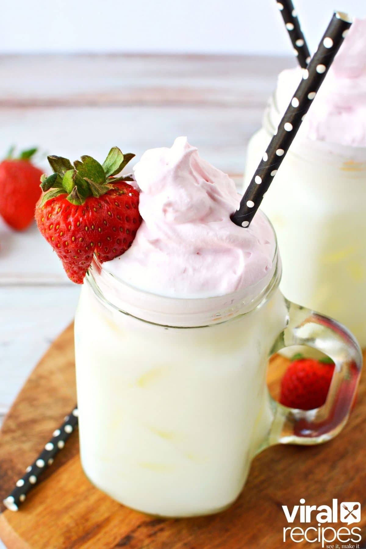 tall glass of whipped strawberry milk.