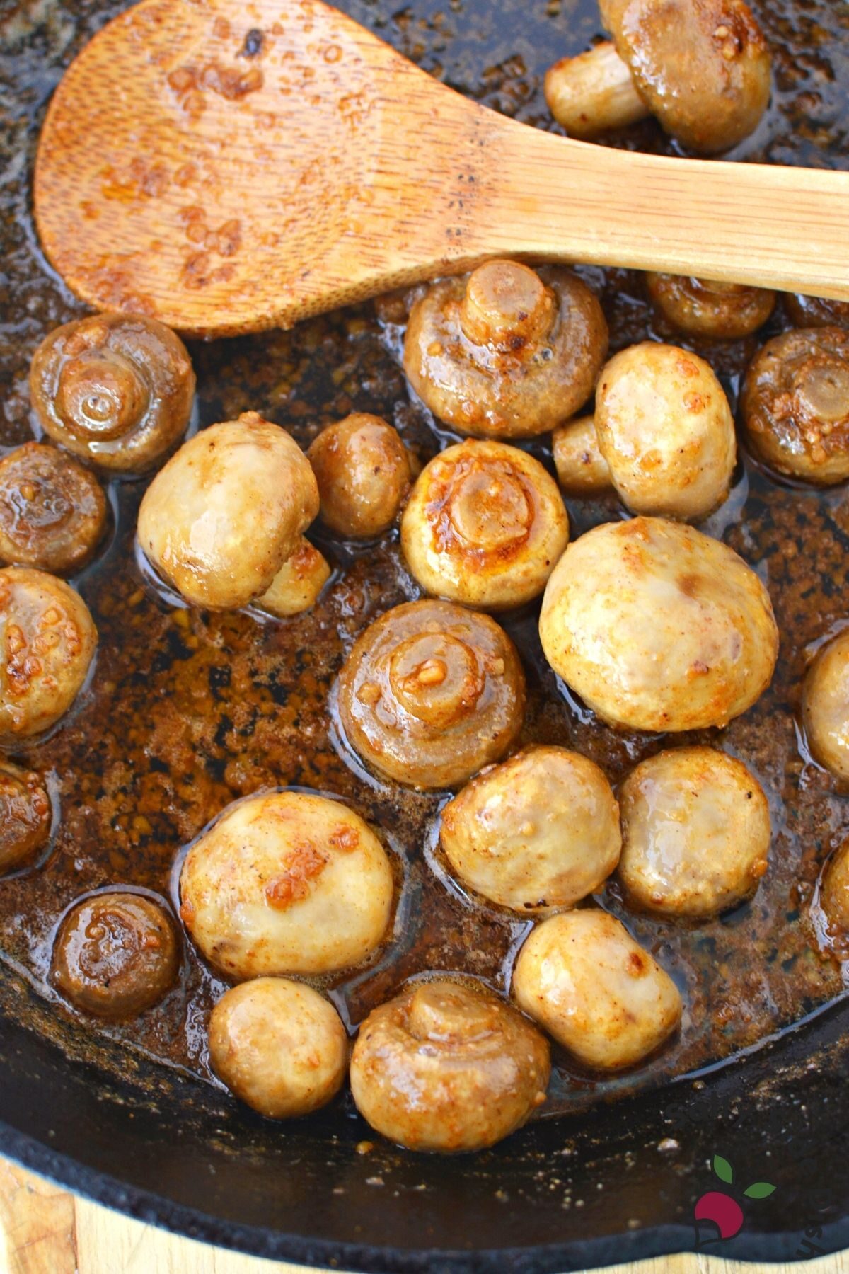 cast iron pan of mushrooms and garlic.