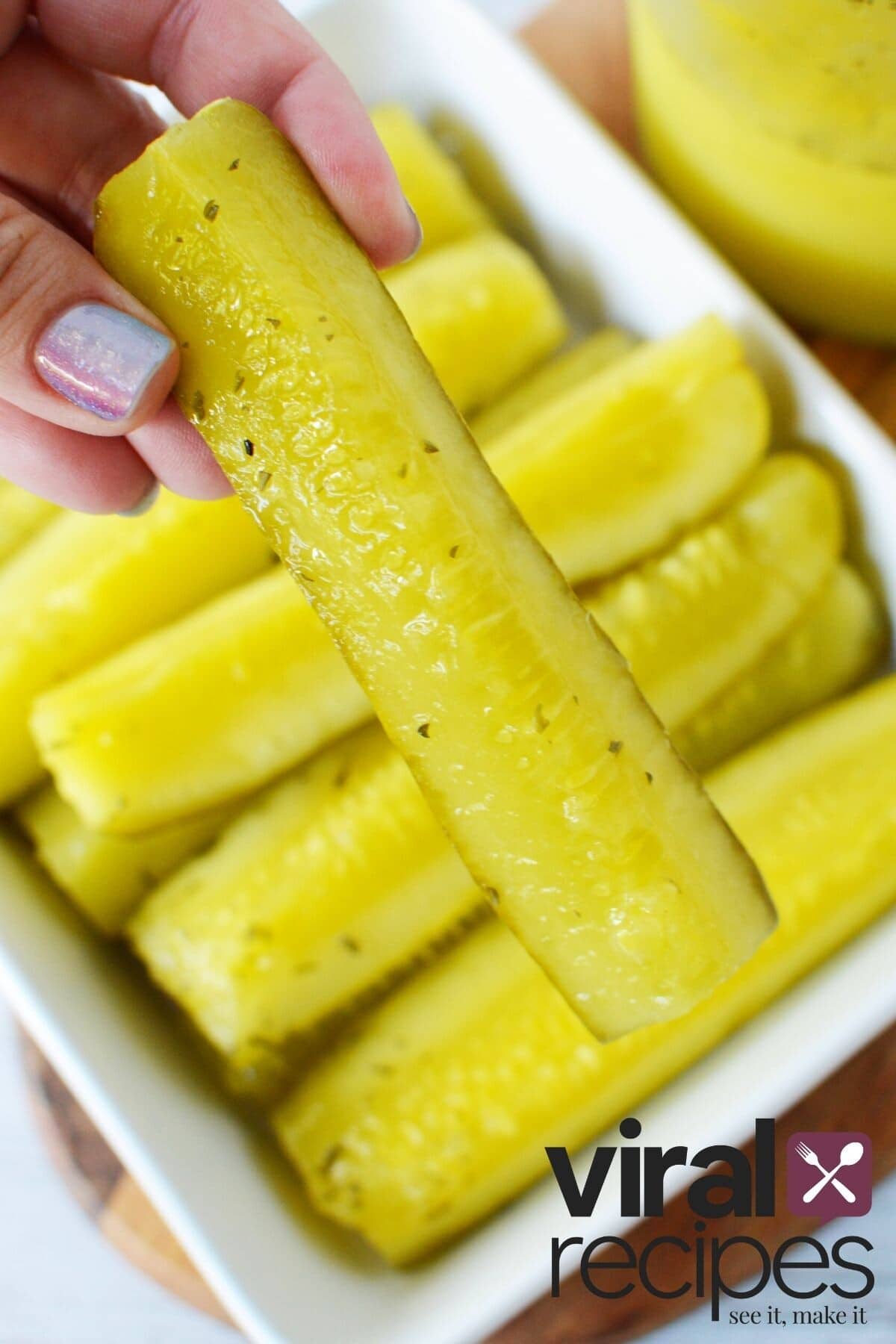 holding a ranch pickle.