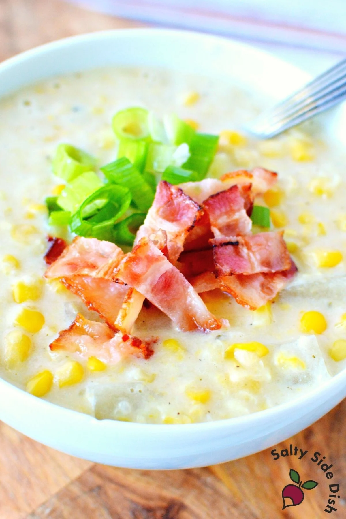 white bowl of corn chowder soup.