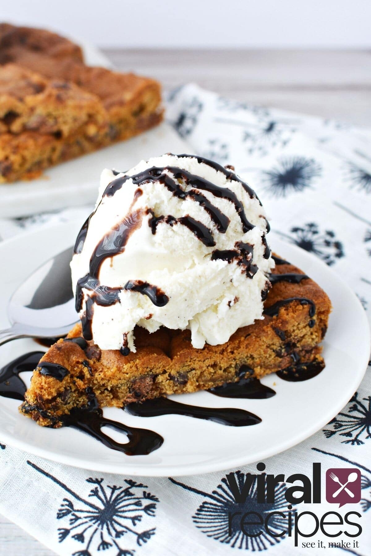 chocolate chip cookie with ice cream and chocolate sauce.