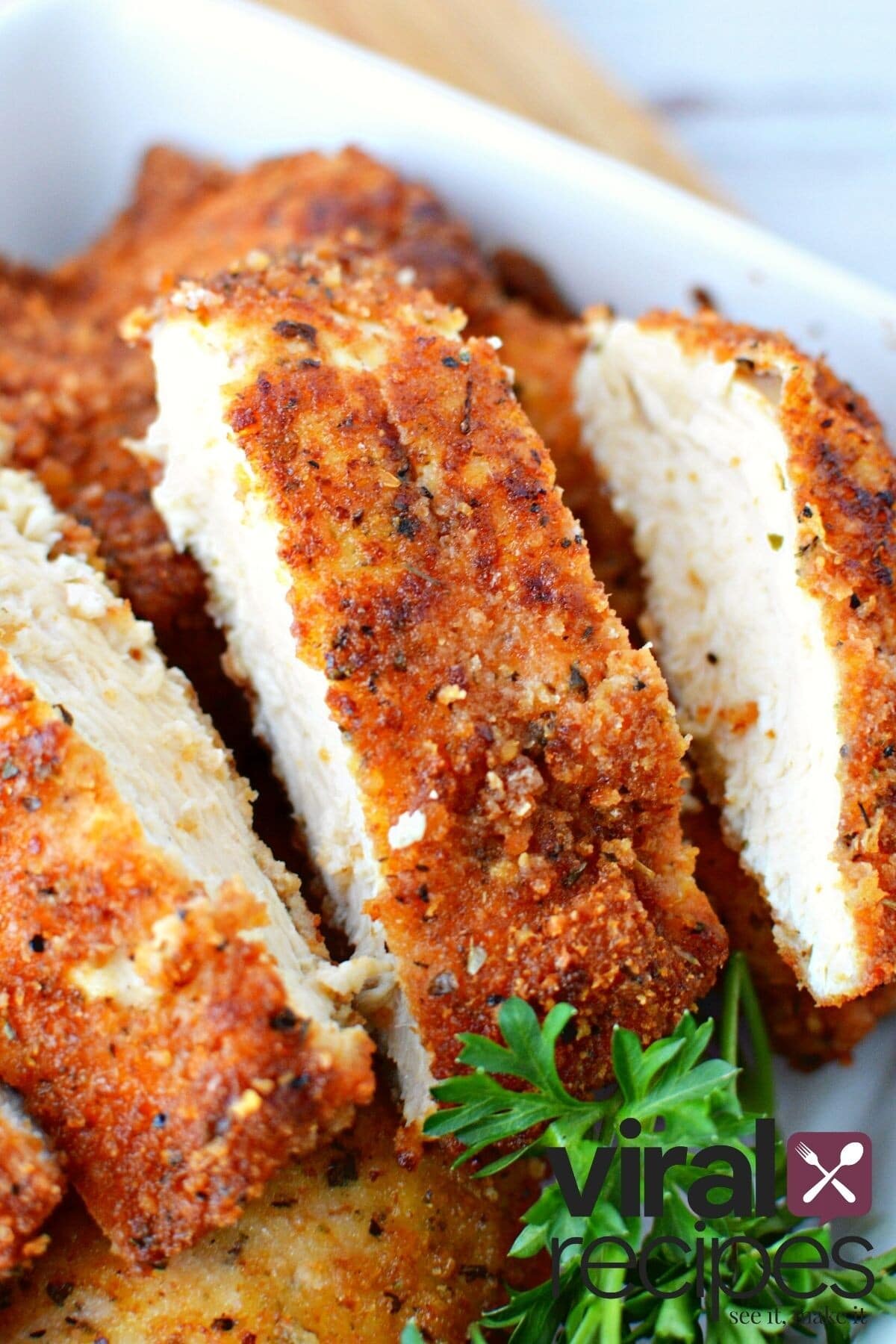 crispy golden chicken cutlet on a plate.