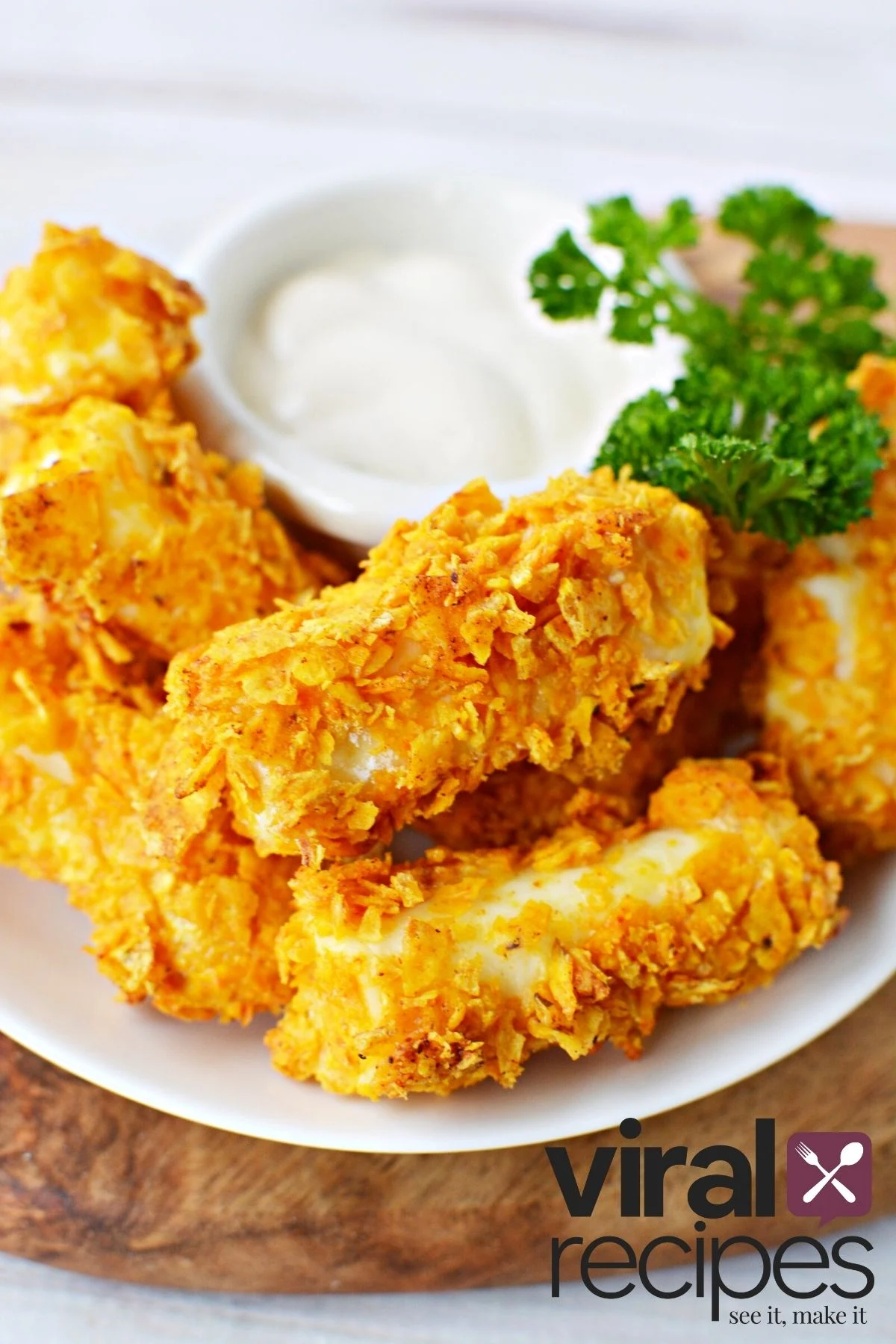 pile of homemade mozzarella sticks with a side of ranch dressing.