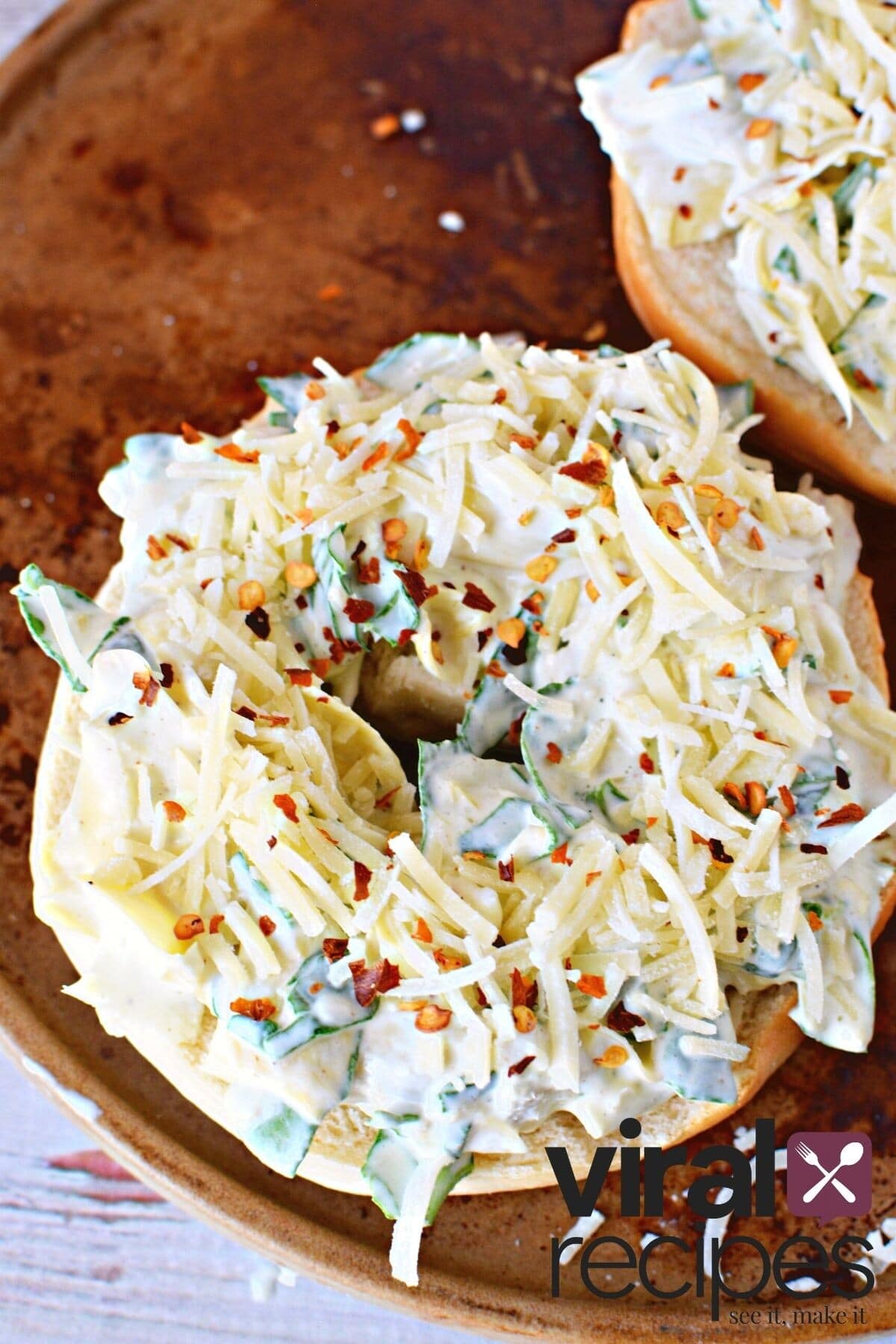 uncooked spinach dip on bagel.