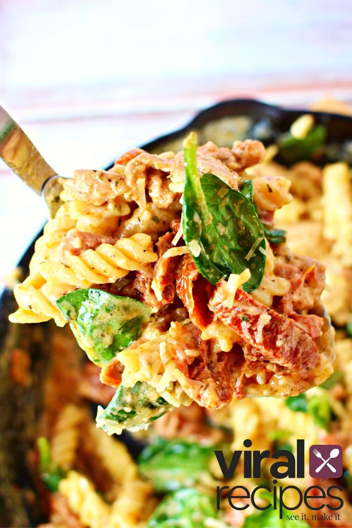 sundried chicken pasta recipe on a spoon.