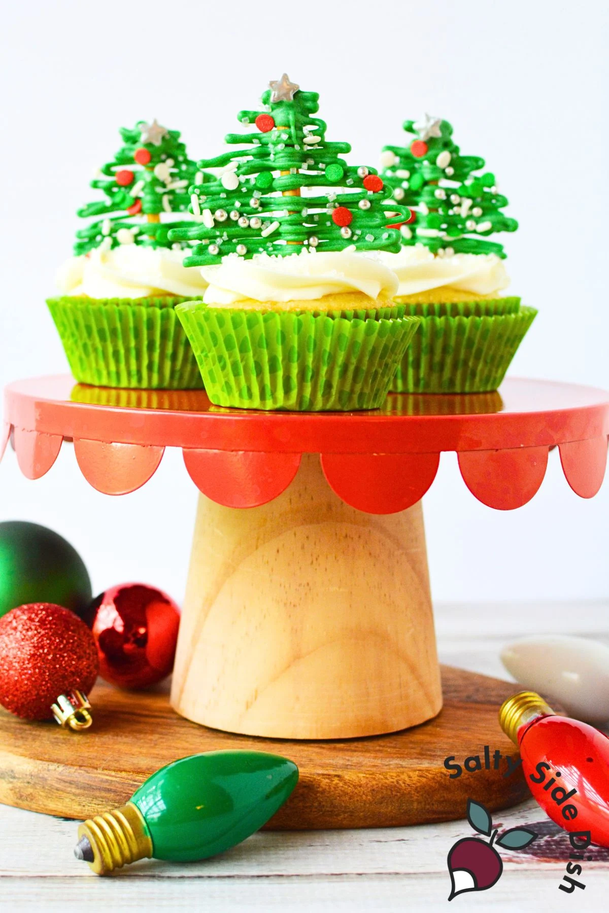 3 Pretzel christmas trees in cupcakes as a topping.