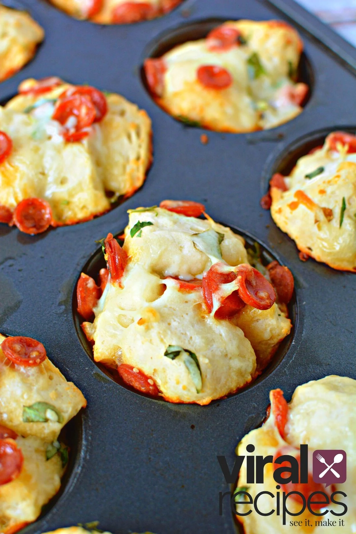 adding pizza dough in muffin tin.