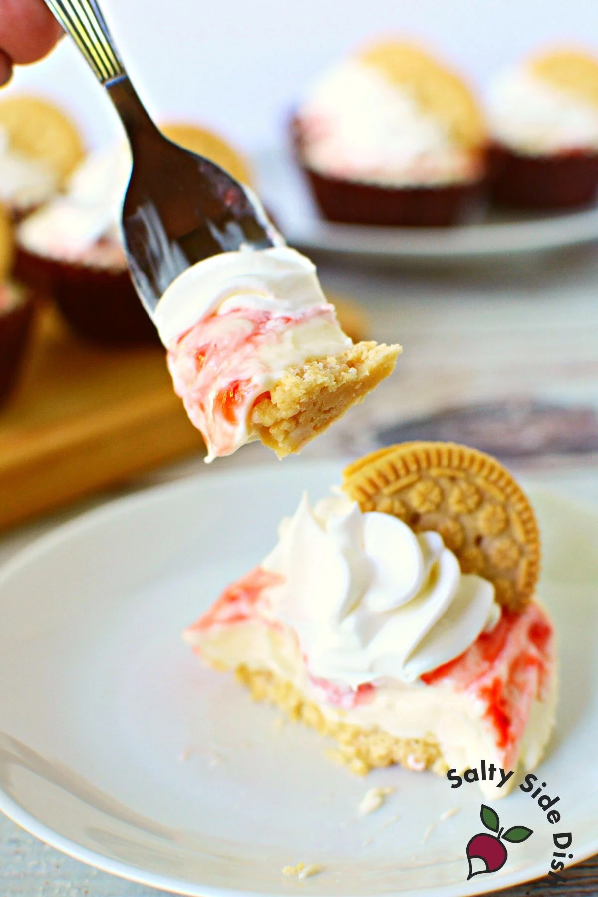 forkful of no bake cheesecake in a cupcake tin.