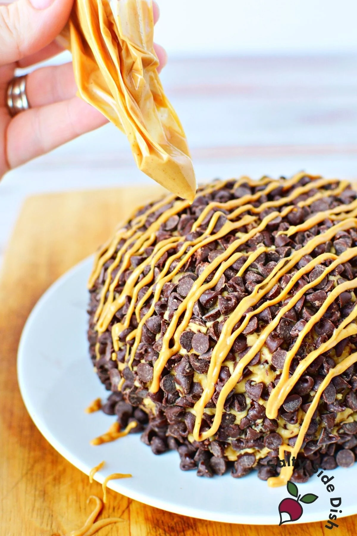 peanut butter drizzle on a cheeseball.
