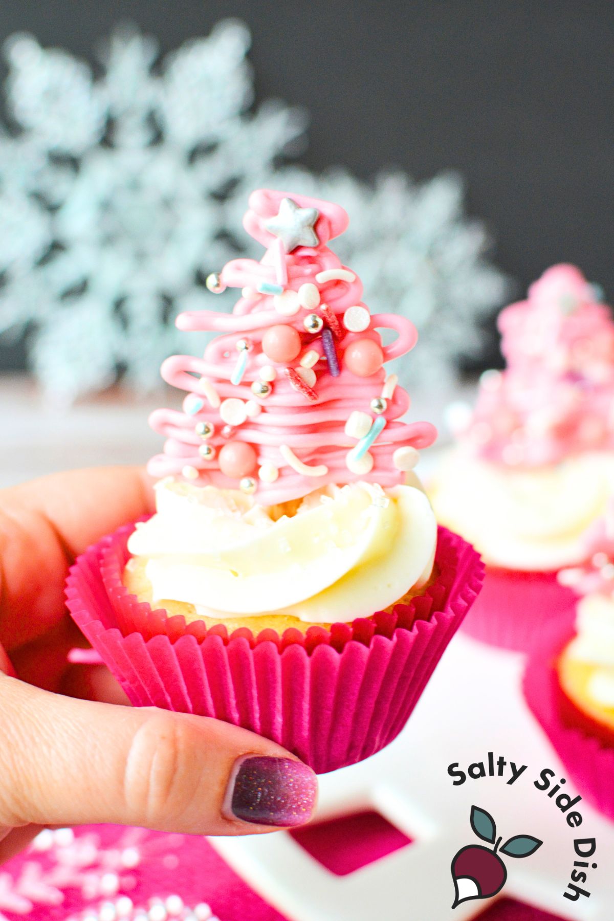 pink christmas trees on top of a cupcake.