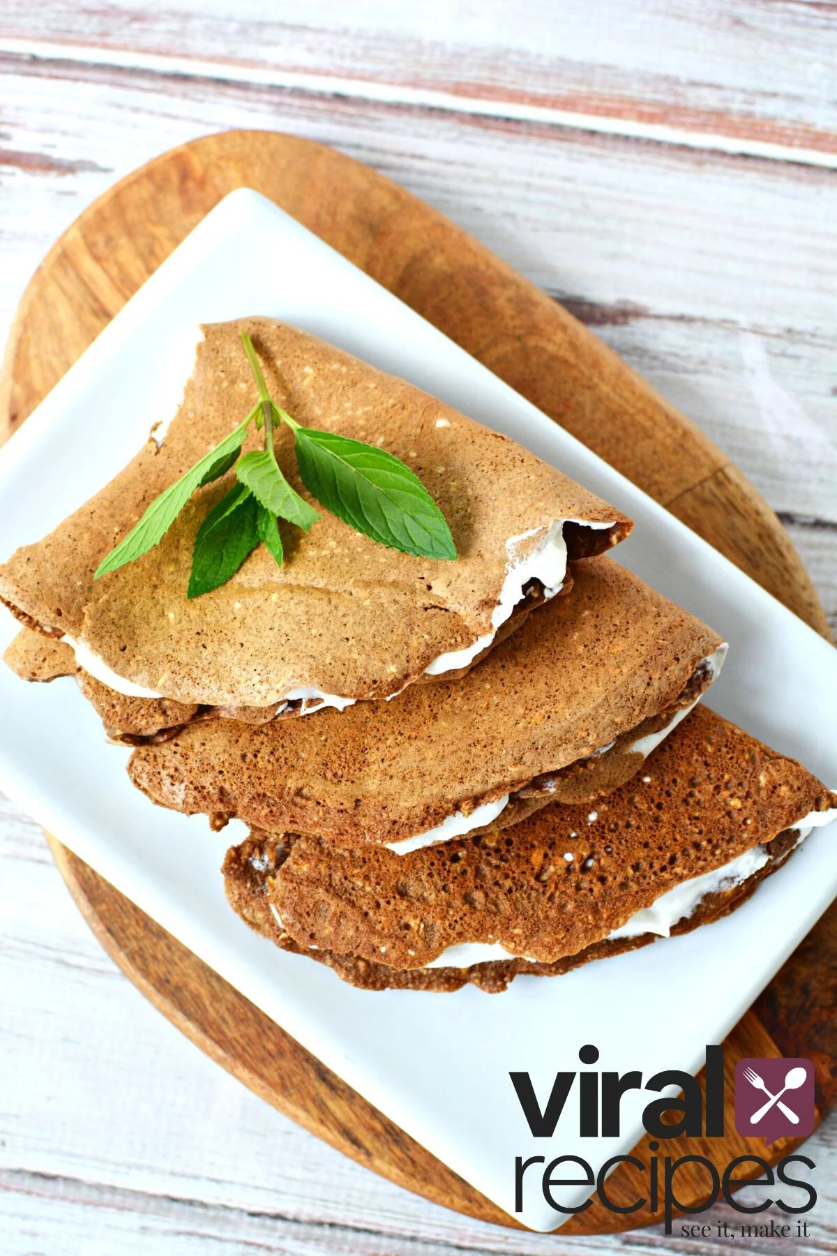 plate of oatmeal crepes with mint leaf.