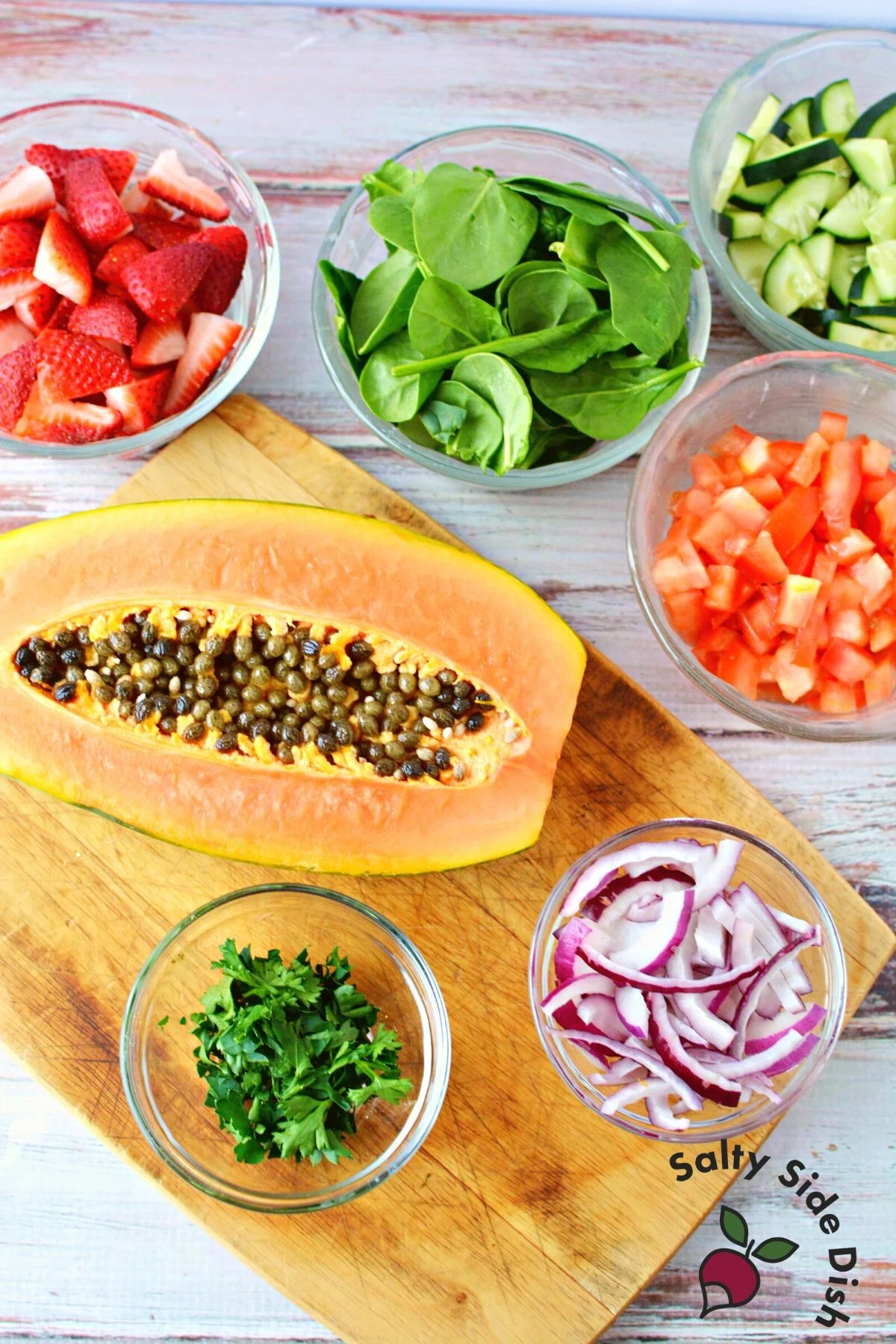 papaya salad with spinach and strawberries.