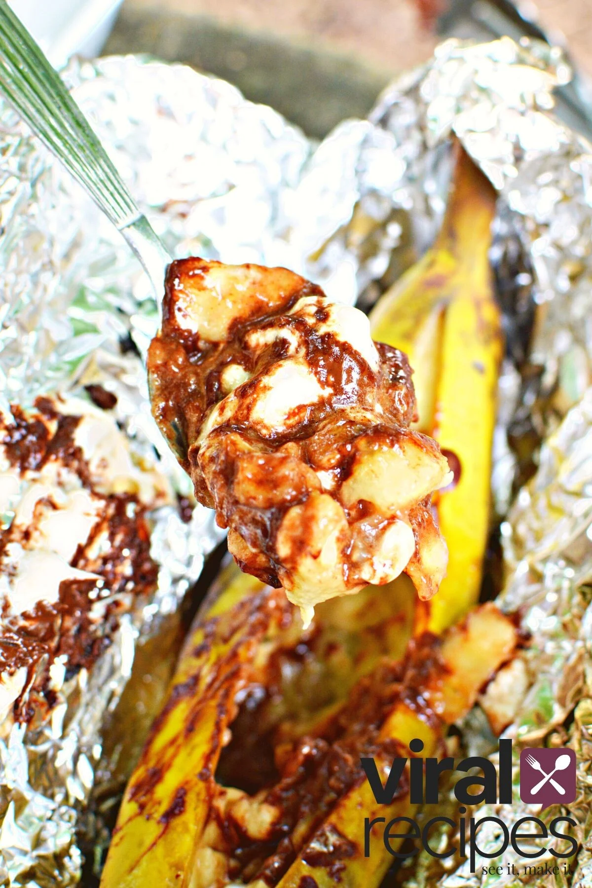 smores with chocolate and marshmallows inside a banana.