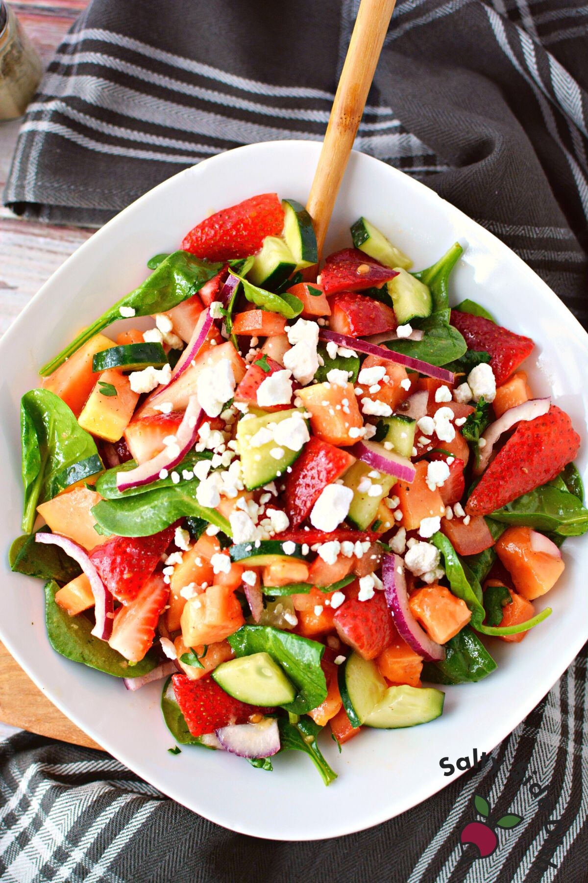 fresh summer salad on a white plate.