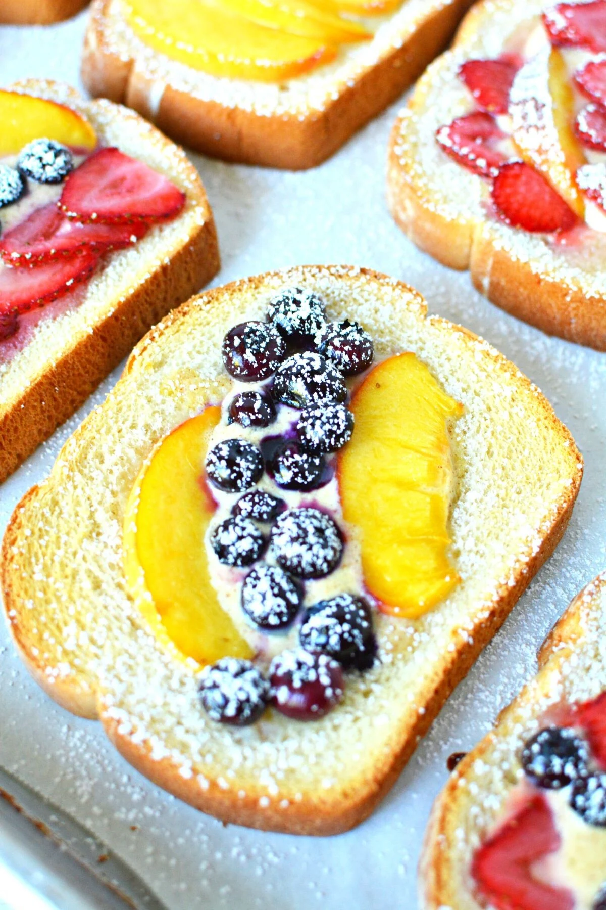 custard toast recipe with peaches and blueberries.