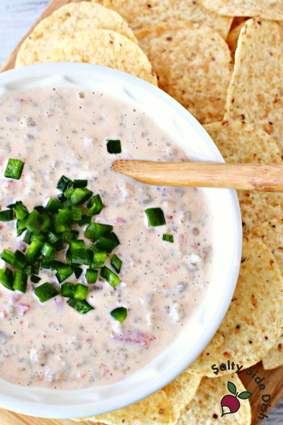 adding jalapenos on top of dip.