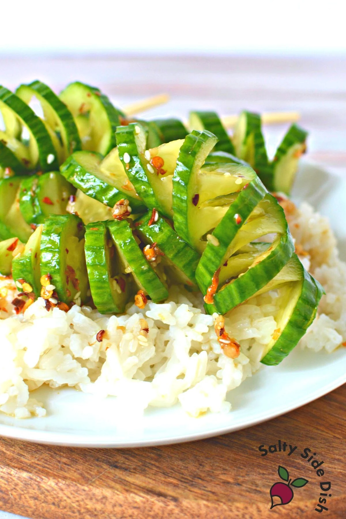 cucumber salad on a bed of rice.