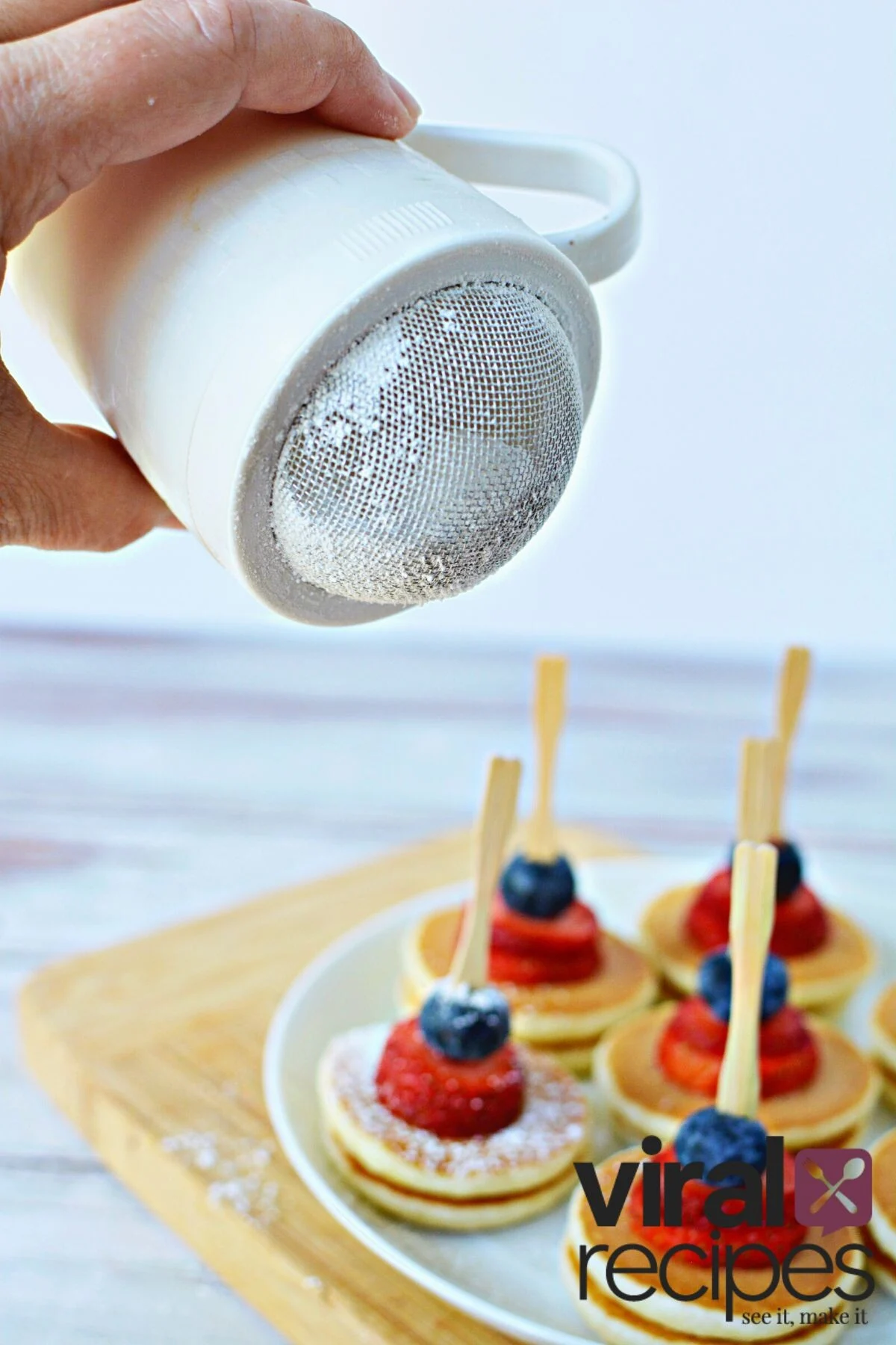 add powdered sugar to pancakes.