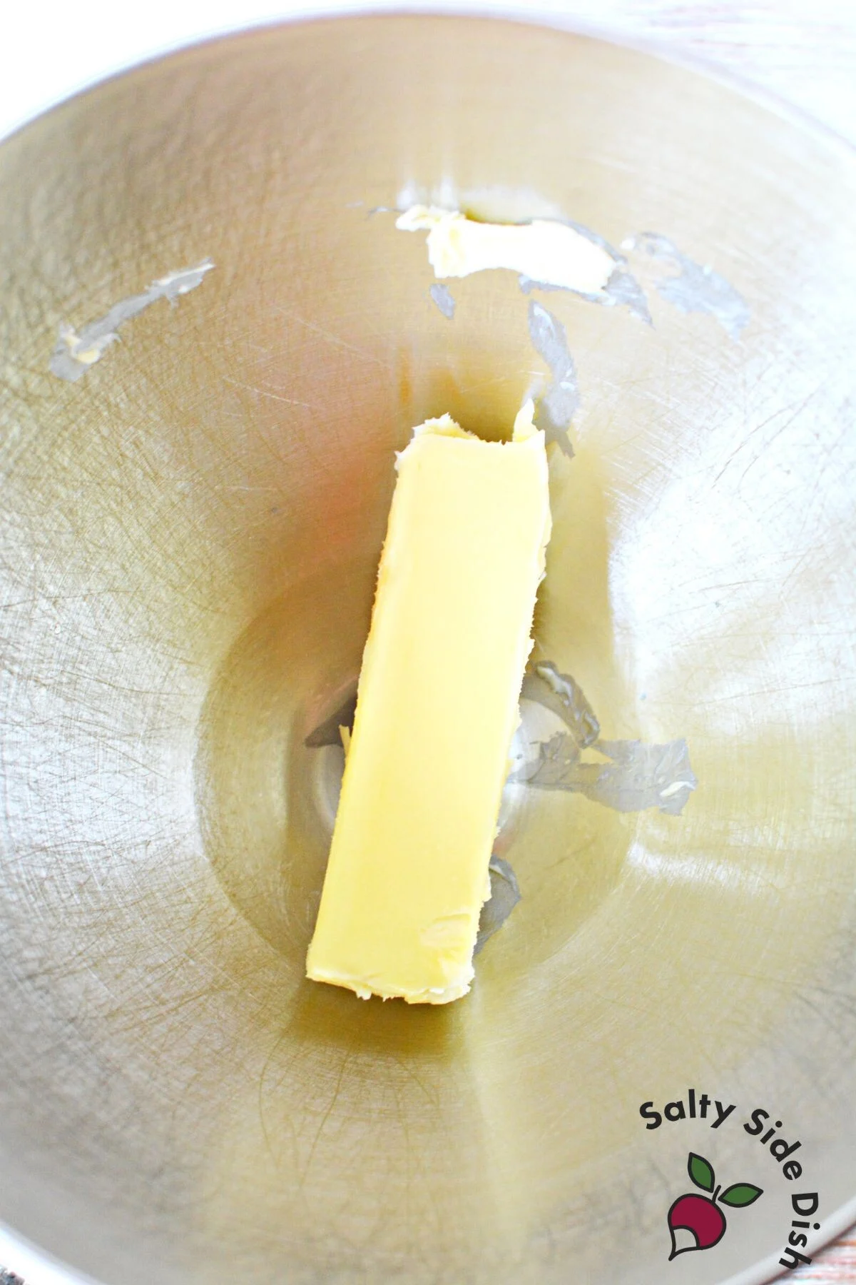 softening butter in a bowl.