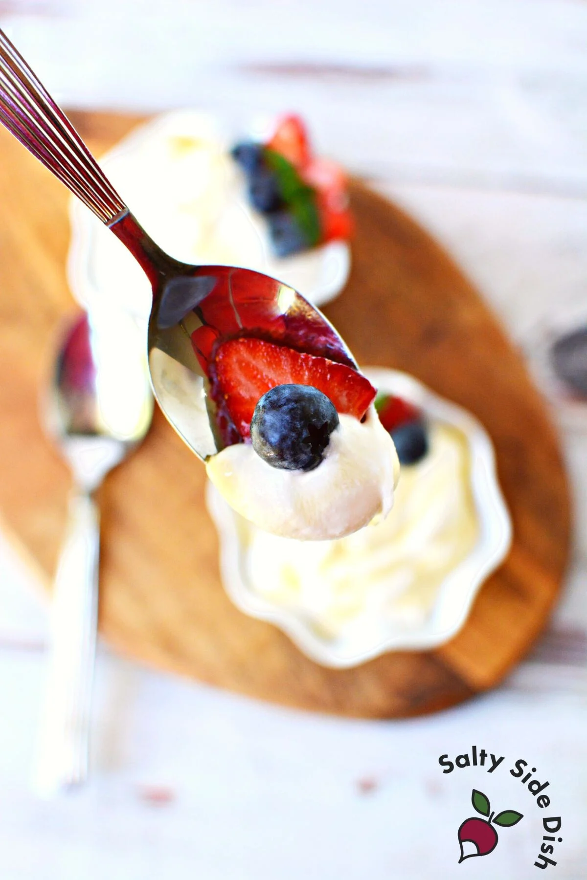 spoon of cottage cheese and blueberries.