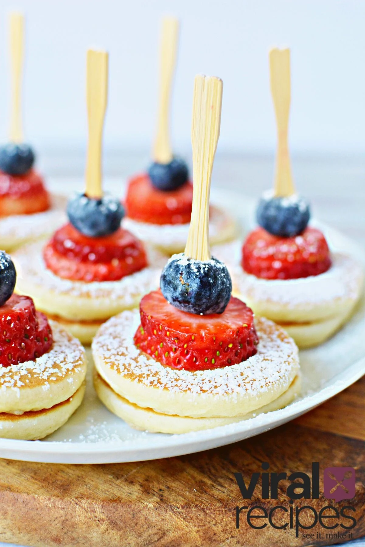 pancake skewers with strawberries and blueberries.