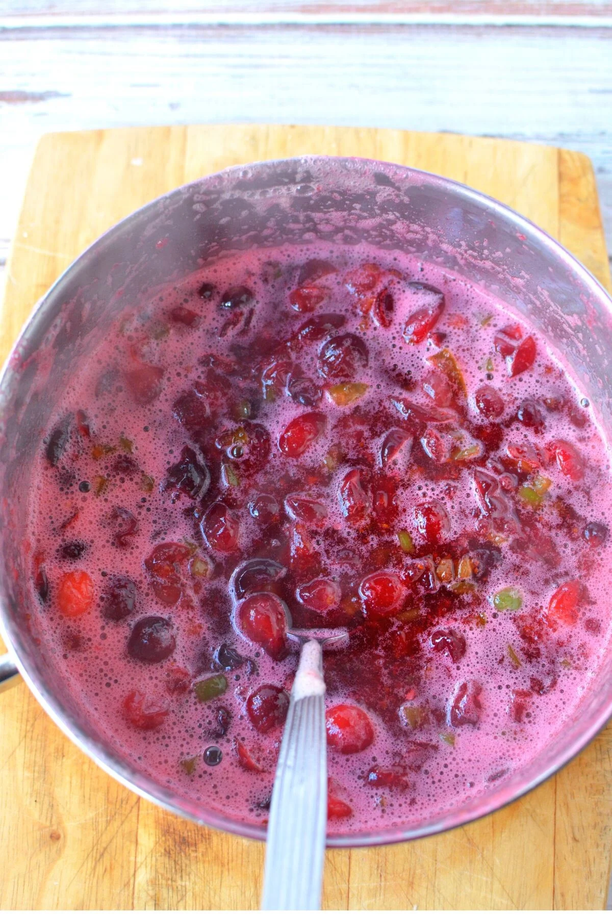 cranberry sauce with jalapenos in a sauce pan.