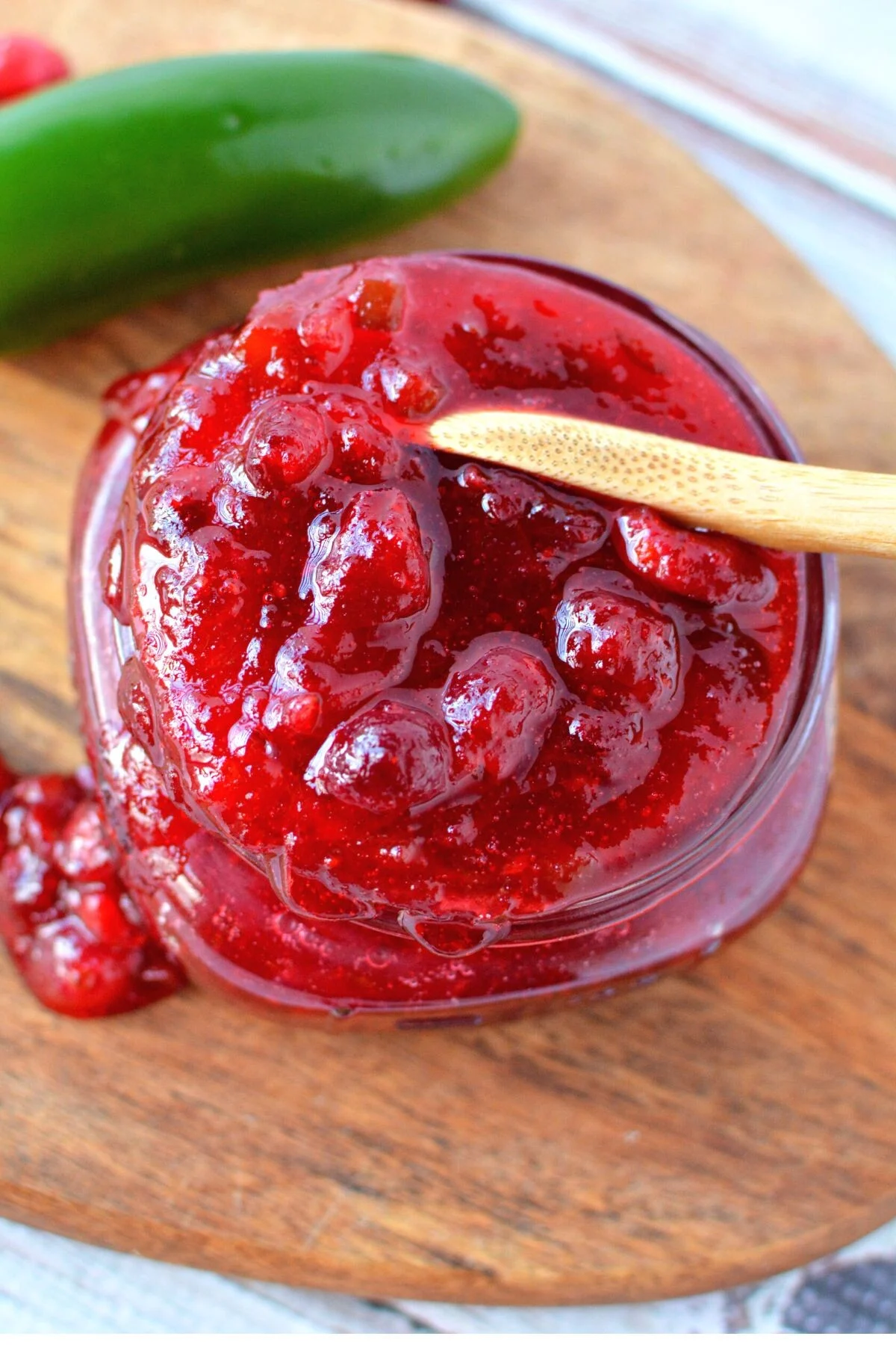 homemade jalapeno cranberry sauce in a jar.