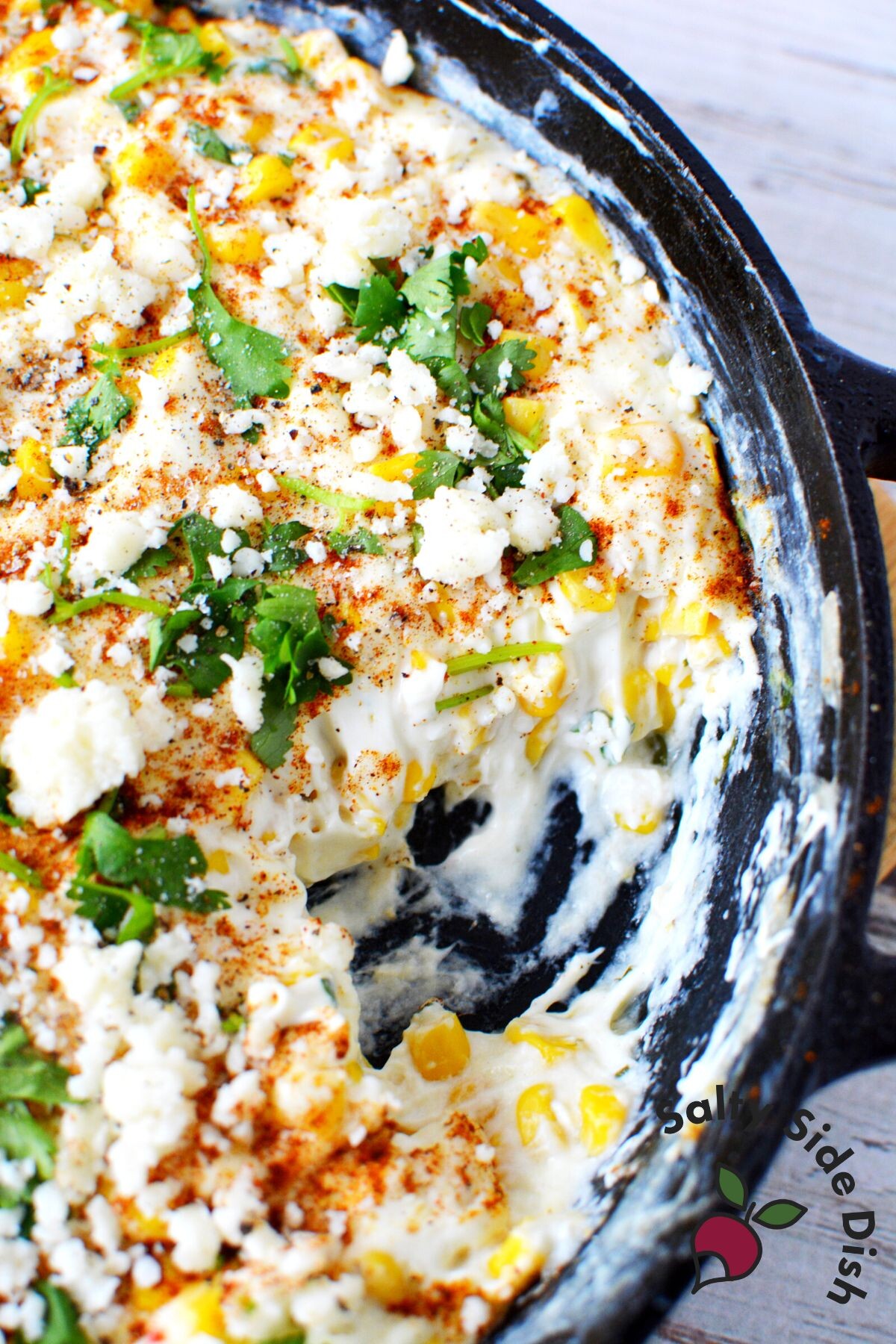 elote dip recipe in cast iron pan.