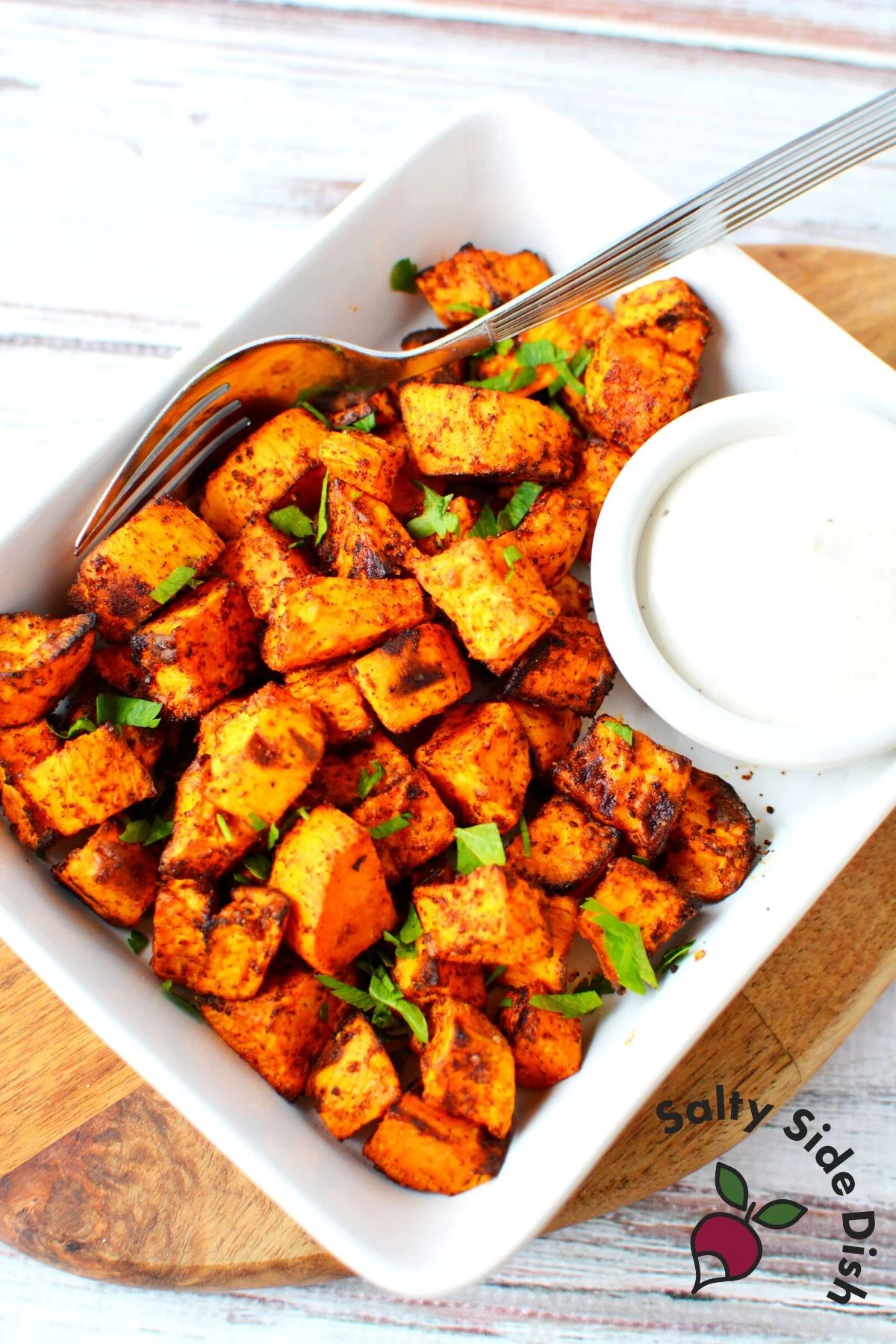 sweet potatoes on a plate ready to eat with dipping sauce.