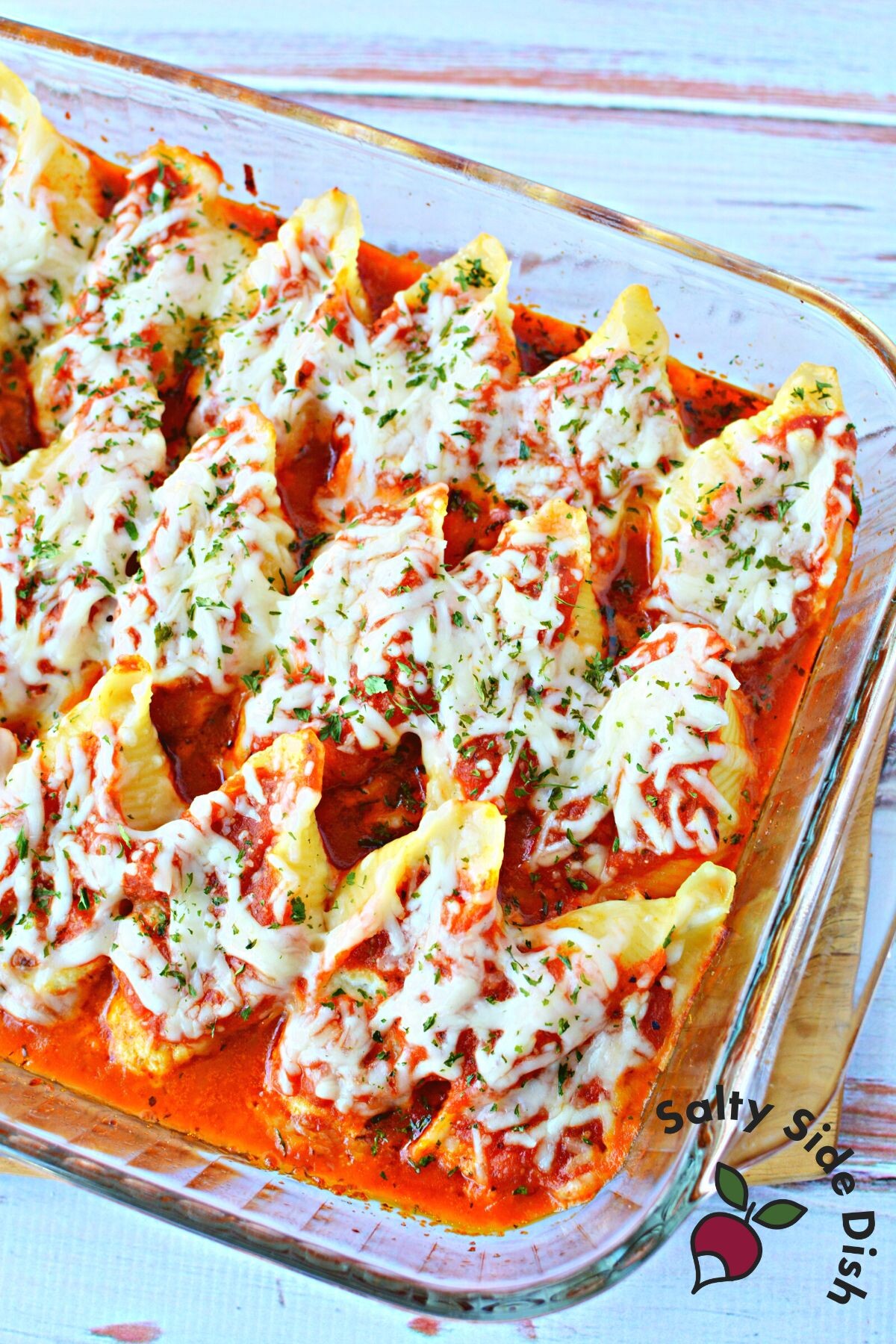 entire casserole dish full of stuffed shells and marinara sauce.