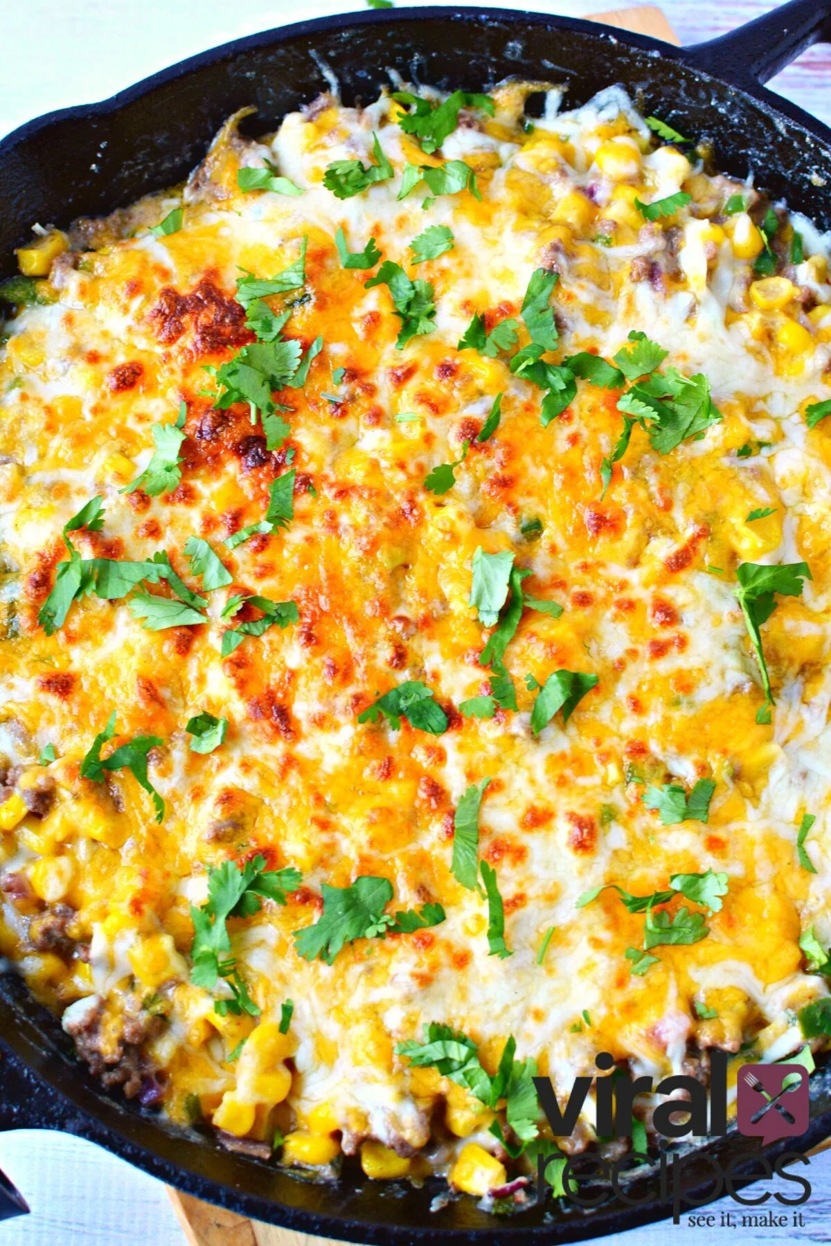 warm elote dip in a cast iron pan.